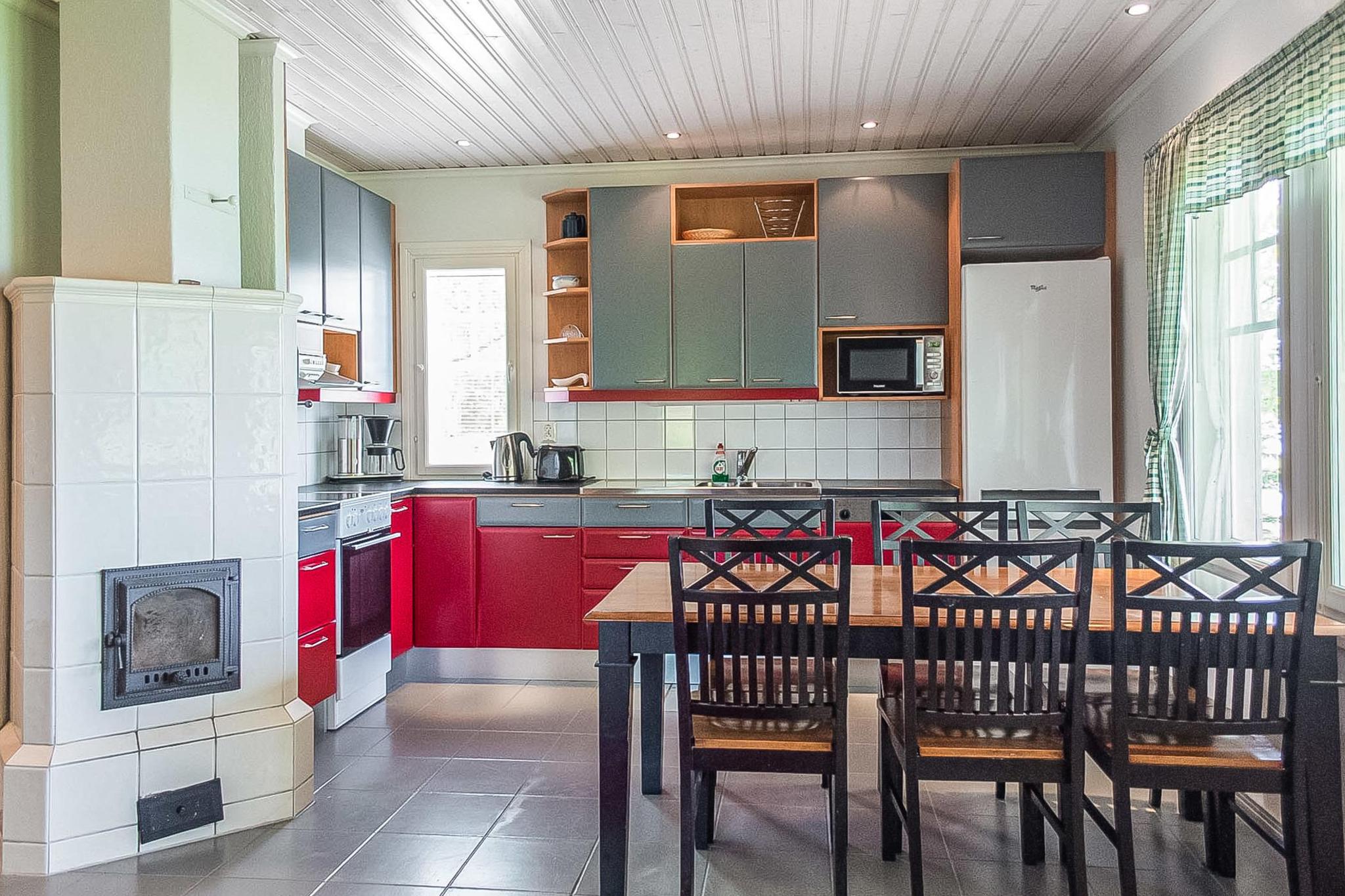 Interior view showing the cozy living room and kitchen area of Hintrekki cottage.