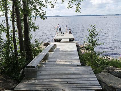 Exterior view of Karikko, set in a serene forested landscape near Lestijärvi Lake.