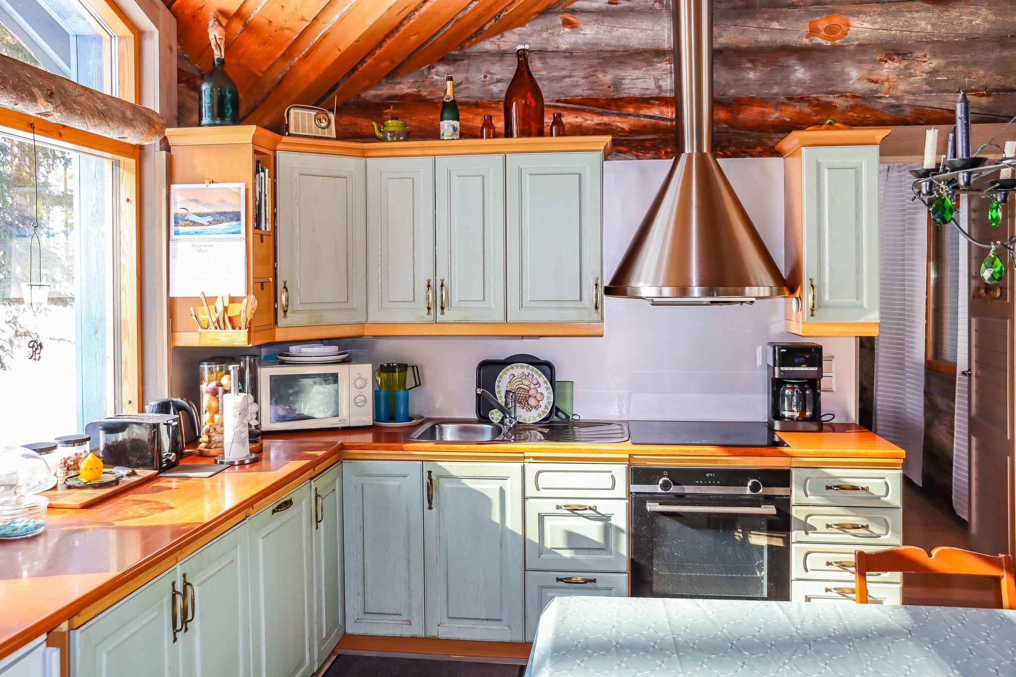 Interior view of the cozy living space in Hopea Ketsu cabin.