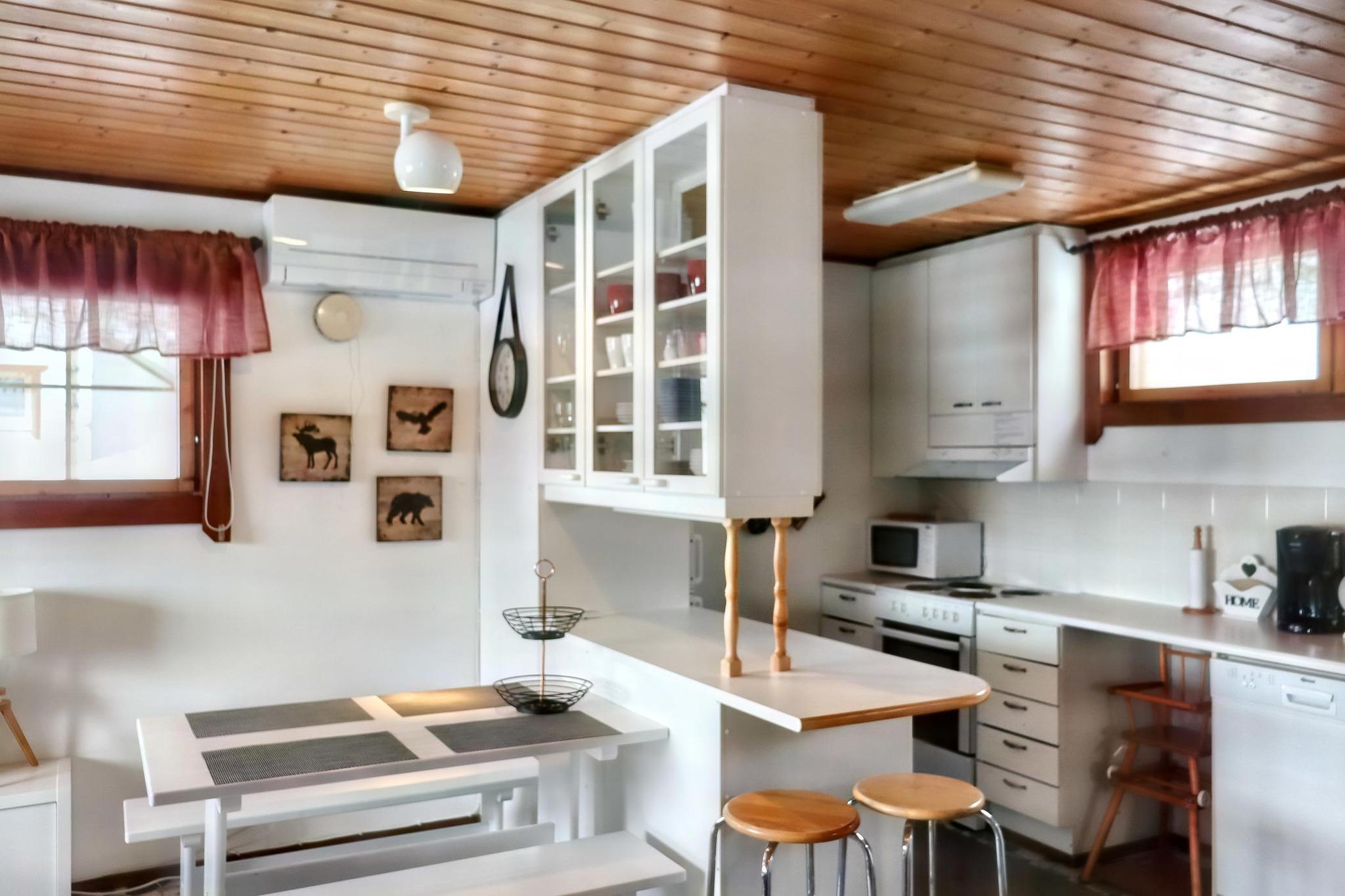 Interior of Pieni Kiiruna apartment showing the modern kitchen and dining area.