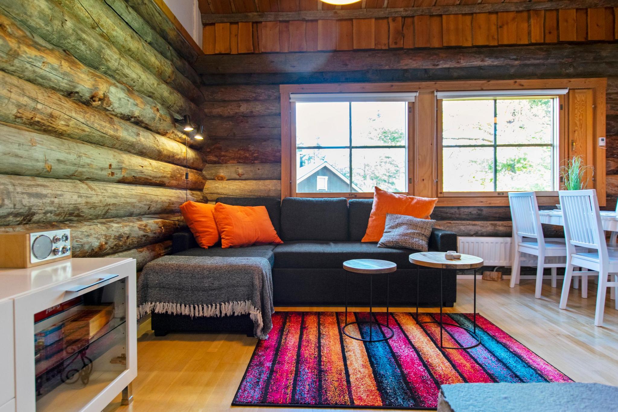 Warm and inviting living room with a natural stone fireplace.