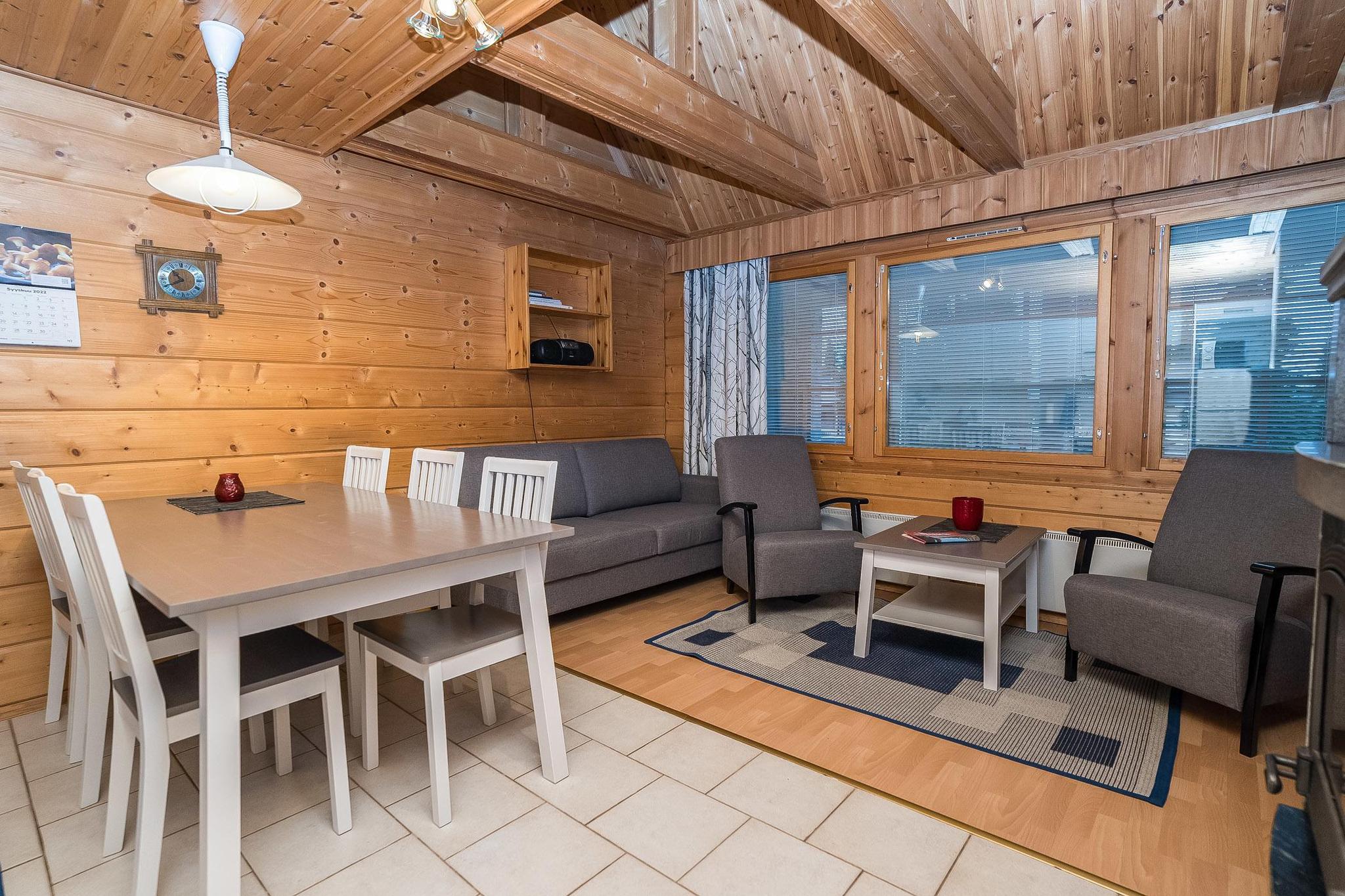 An apartment located in a log-built semi-detached house at Rukannaava 1A in Vuosselinrinne, Kuusamo, Northern Ostrobothnia, approximately 25km north of Kuusamo and 800m from Vuosseli (Eastern Ruka). Built in 2000, the apartment includes a bedroom with a double bed, a second bedroom on a loft with two beds, an additional loft space with a convertible sofa for two and two more beds, and a combined kitchen and living room. The total area is 52 m² with an additional 26 m² loft, with the loft's highest point at 190 cm.