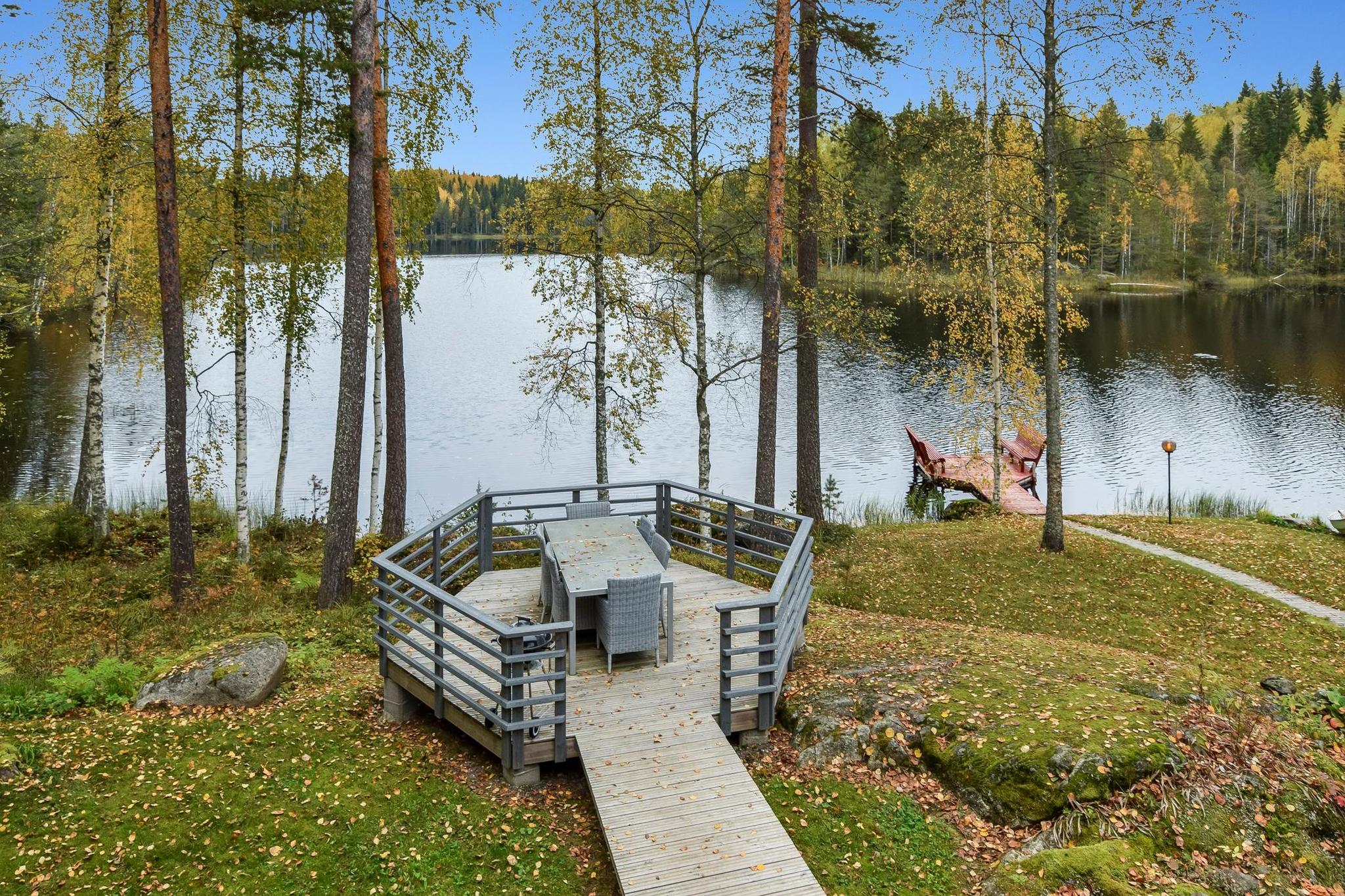 Exterior night view of Mykkylä cottage, showcasing its peaceful setting.